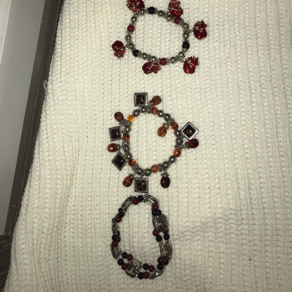 2 gamecock bracelets and brown/silver bracelet